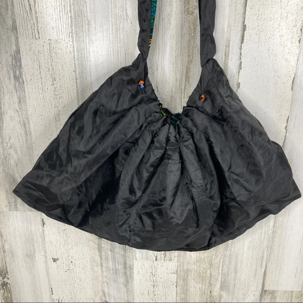 handmade travel hobo bag with paper bead design